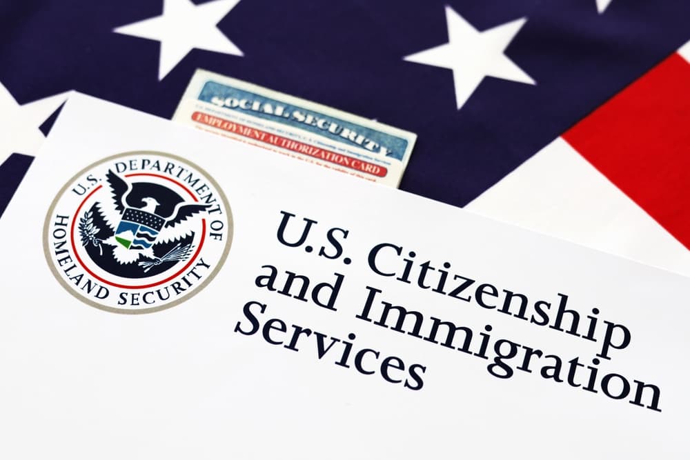 Logo of U.S. Citizenship and Immigration Services with Social Security.